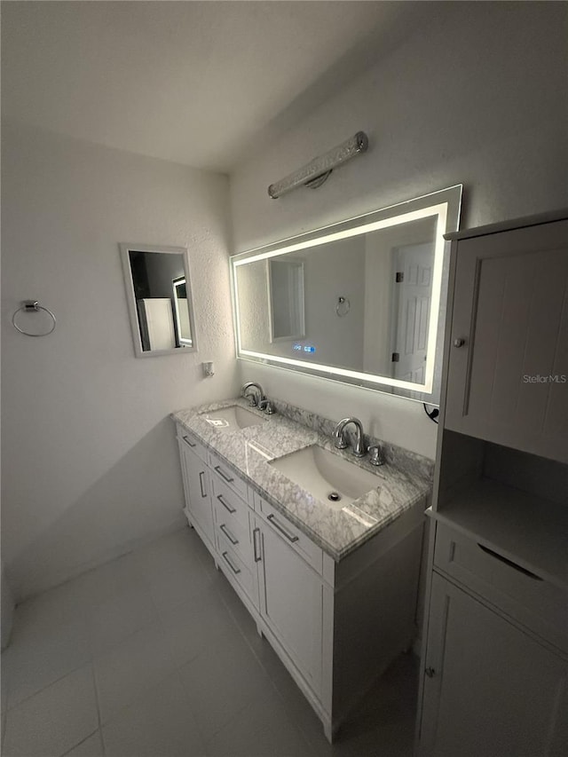 bathroom with a sink and double vanity