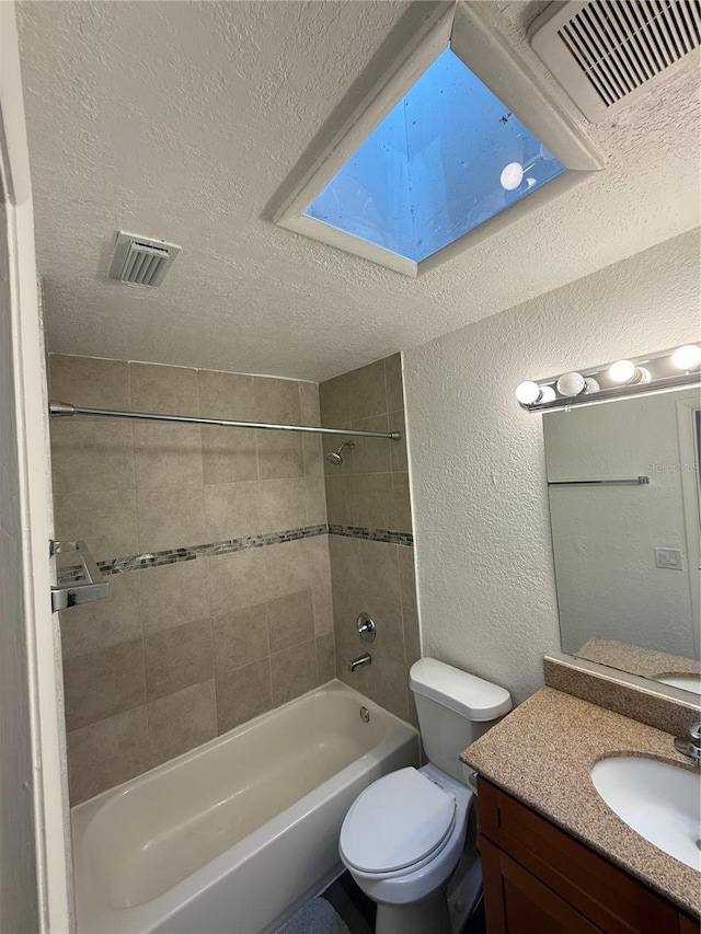 full bath featuring visible vents, a textured wall, a textured ceiling, and shower / bathing tub combination