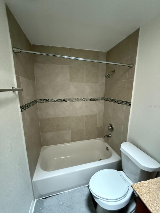 bathroom with shower / tub combination, vanity, and toilet