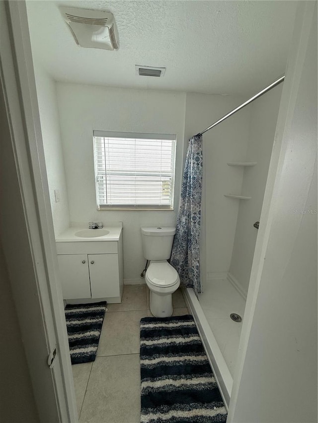 full bathroom with visible vents, toilet, tile patterned flooring, a textured ceiling, and a shower stall