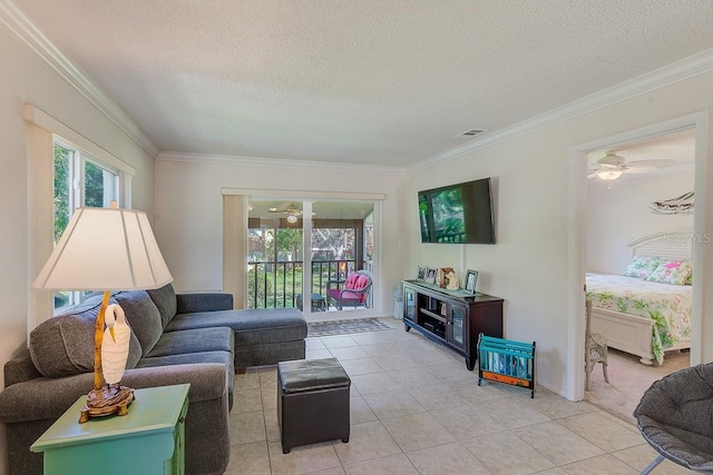 tiled living room featuring crown molding and a textured ceiling