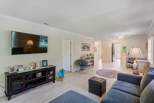 living room with light tile patterned floors, crown molding, a textured ceiling, and ceiling fan