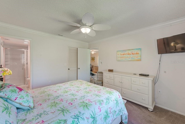 bedroom featuring ensuite bathroom, a textured ceiling, ornamental molding, carpet flooring, and ceiling fan