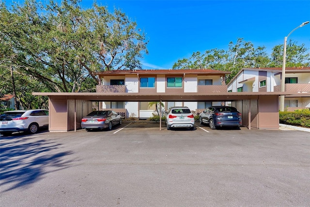 multi unit property featuring a carport