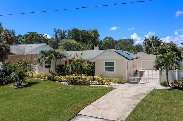 view of front of home featuring a front yard and a garage