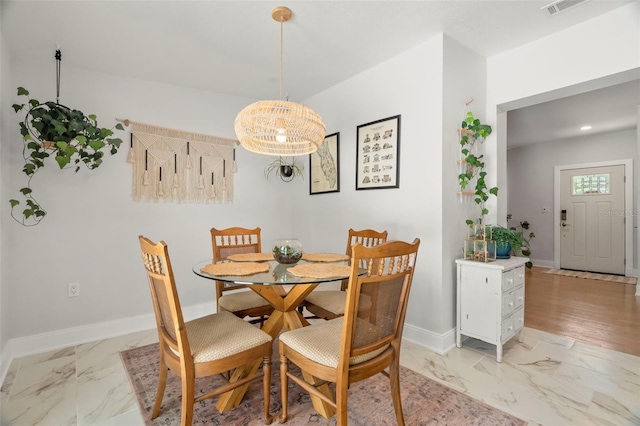 dining space featuring a chandelier