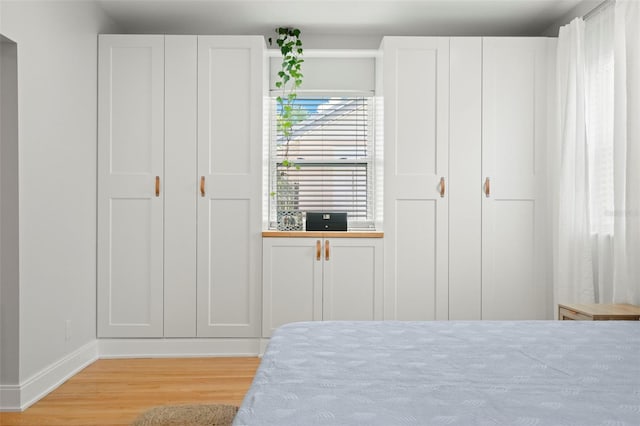 bedroom featuring light wood-type flooring