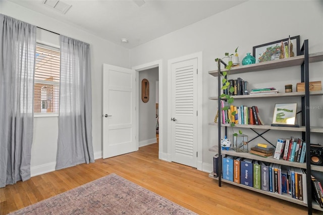 living area featuring hardwood / wood-style floors