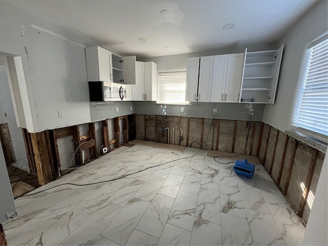 kitchen featuring white cabinetry