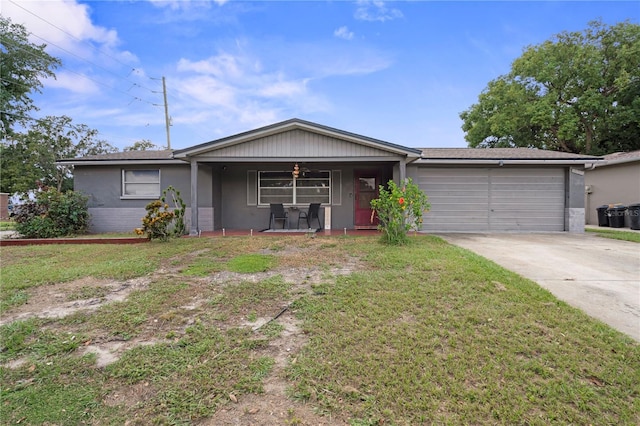 ranch-style house with a front lawn, a porch, and a garage