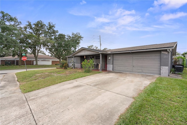 ranch-style home with a front yard and a garage