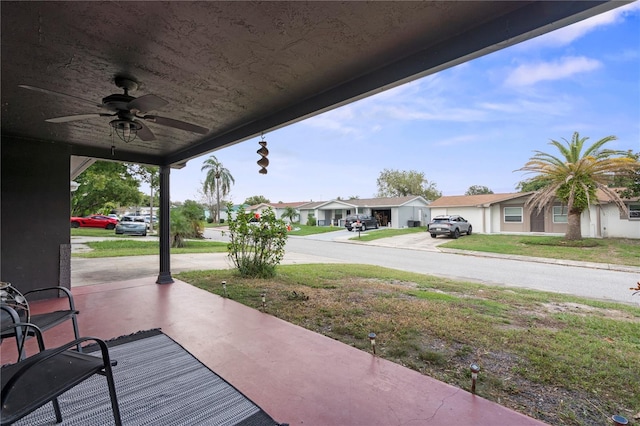 view of patio featuring ceiling fan