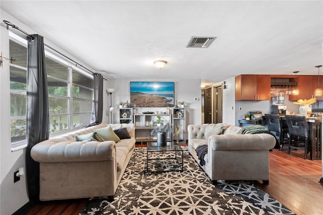 living room with dark hardwood / wood-style floors