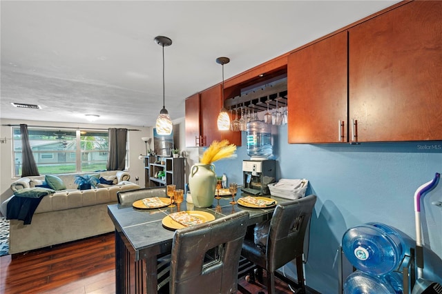 dining room with dark hardwood / wood-style flooring