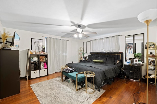 bedroom featuring ceiling fan and dark hardwood / wood-style flooring