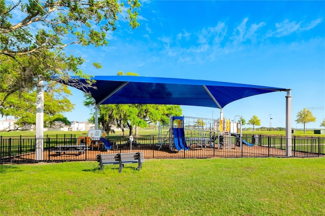 view of playground with a lawn