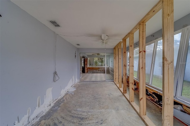 interior space with ceiling fan and a wealth of natural light