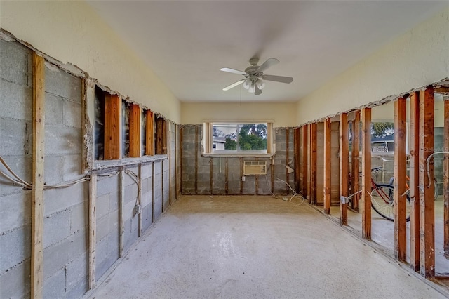 misc room with ceiling fan and an AC wall unit