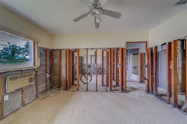 miscellaneous room featuring a wall unit AC and ceiling fan