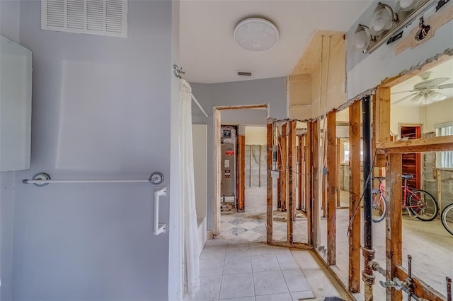 corridor with light tile patterned flooring