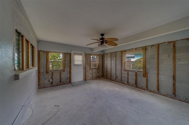 unfurnished room featuring ceiling fan and cooling unit