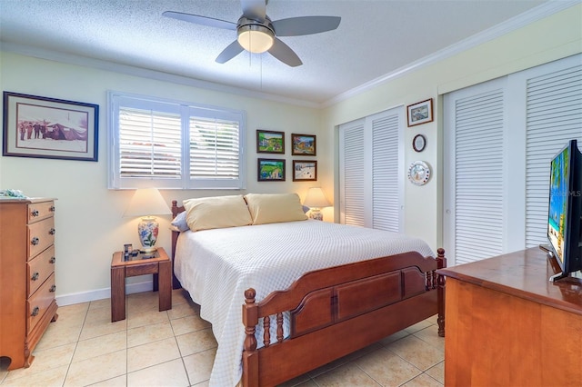 tiled bedroom featuring ceiling fan, crown molding, and a textured ceiling