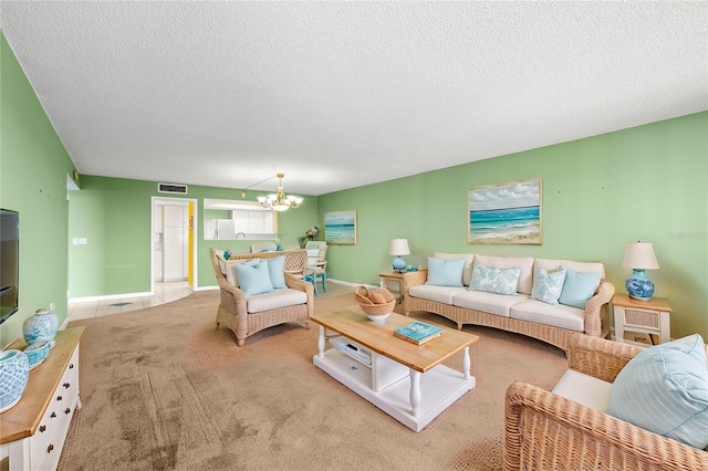 living room featuring light colored carpet, a chandelier, and a textured ceiling