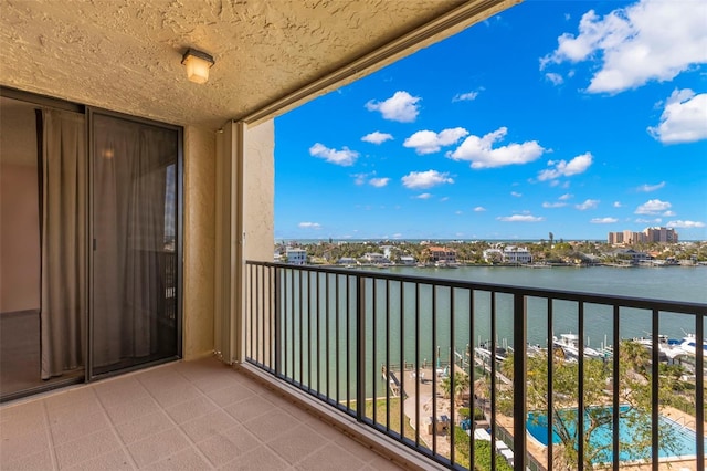 balcony featuring a water view