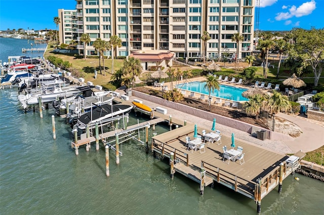 exterior space with a water view and a community pool