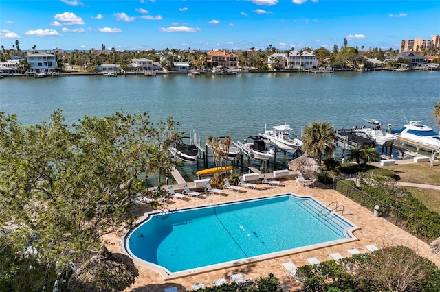 exterior space featuring a water view and a patio area