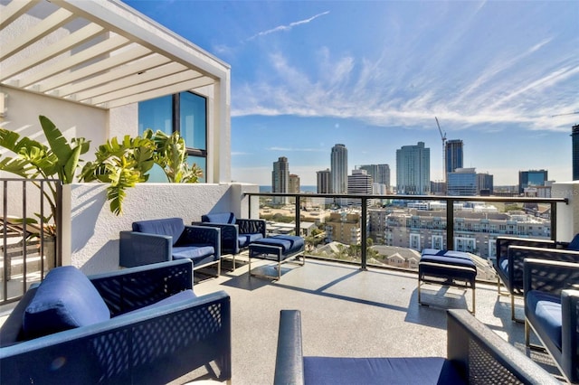 view of patio featuring a balcony and an outdoor hangout area