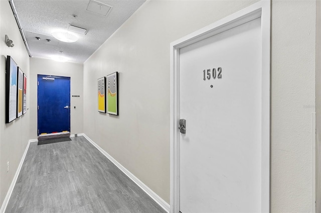 interior space with hardwood / wood-style floors and a textured ceiling