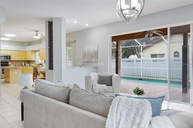 tiled living room featuring ceiling fan