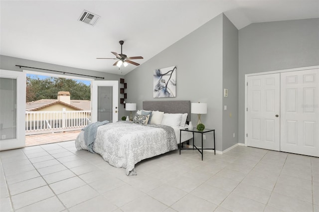 tiled bedroom with access to outside, vaulted ceiling, a closet, and ceiling fan