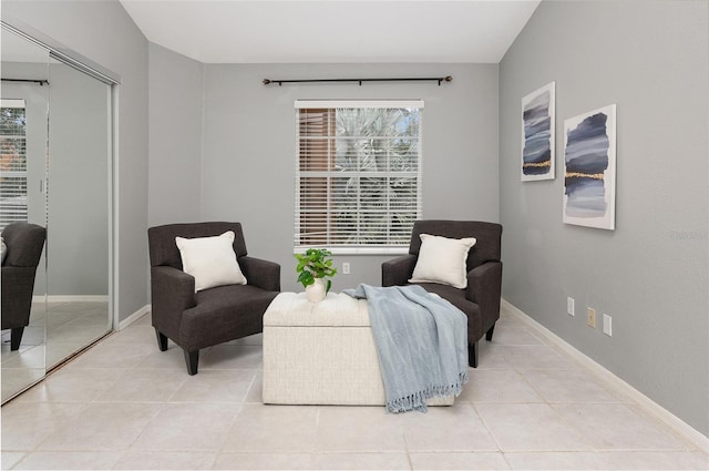 living area featuring light tile patterned flooring