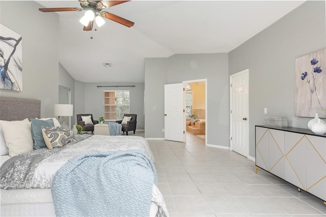 bedroom featuring ceiling fan, connected bathroom, and lofted ceiling