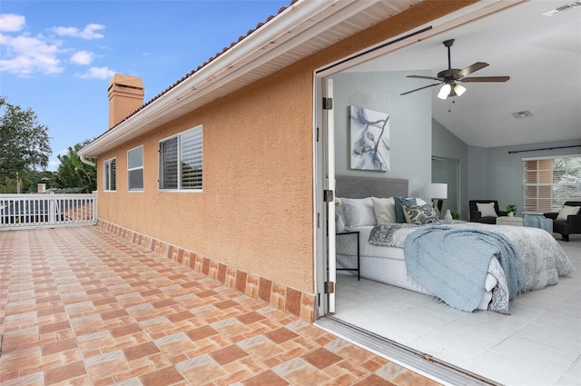 bedroom featuring vaulted ceiling and ceiling fan