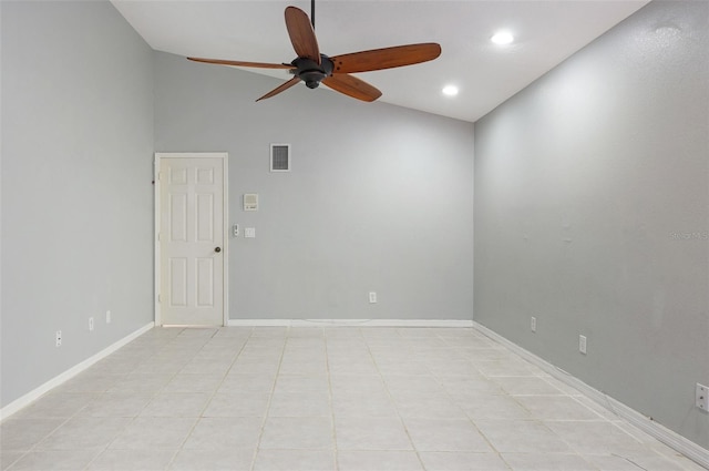 empty room featuring vaulted ceiling and ceiling fan