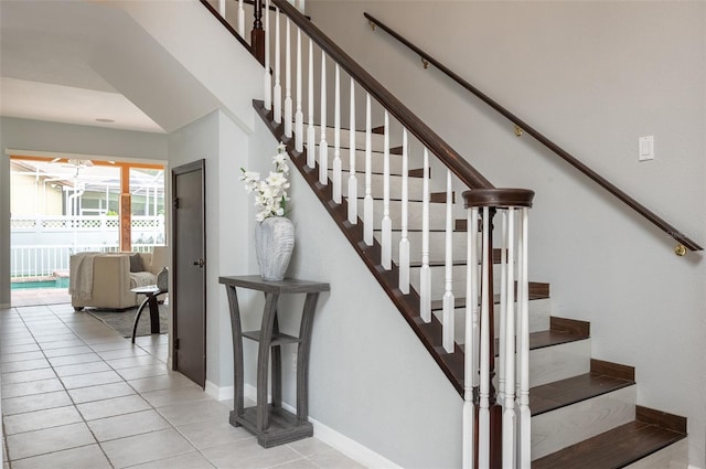 staircase with tile patterned floors