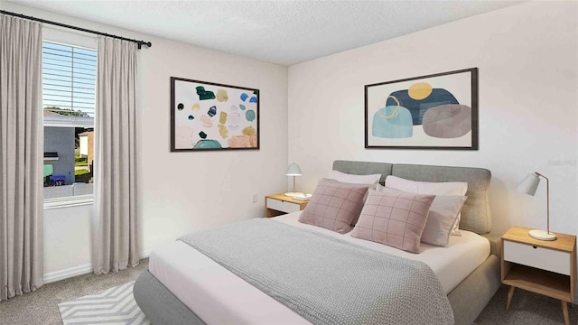 carpeted bedroom with a textured ceiling