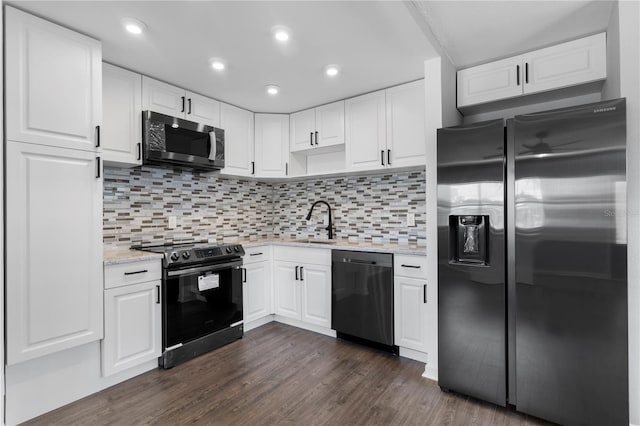 kitchen with backsplash, dark wood-type flooring, sink, black appliances, and white cabinetry