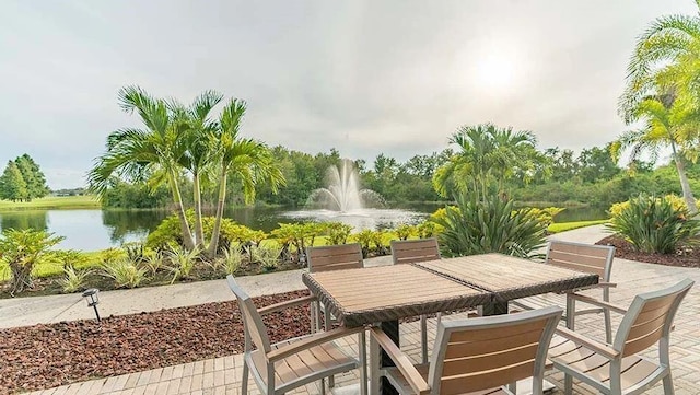 view of patio with a water view