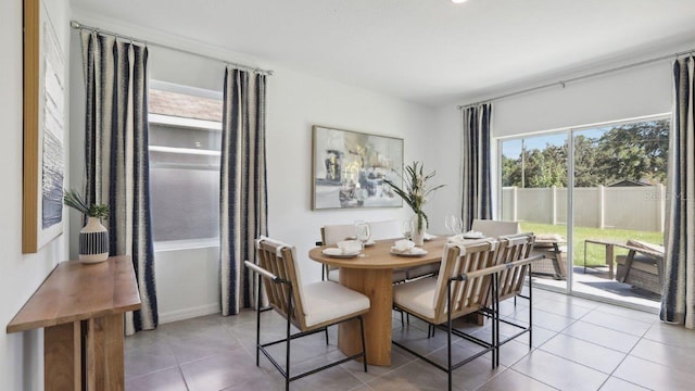 dining area with light tile patterned floors