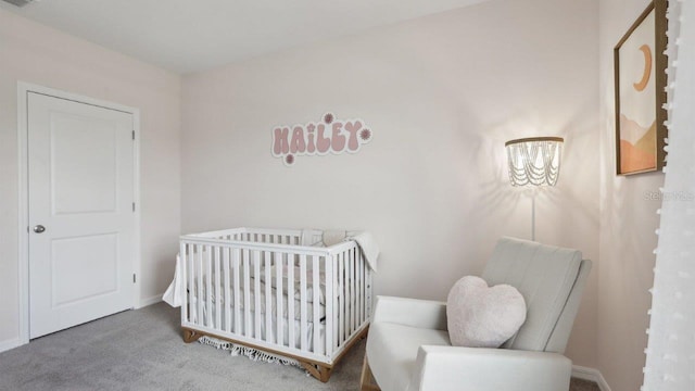 carpeted bedroom with a crib