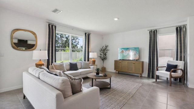 living room featuring light tile patterned flooring