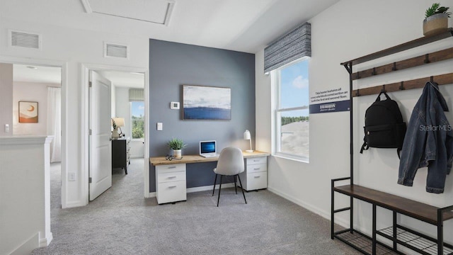 office area with light carpet and built in desk