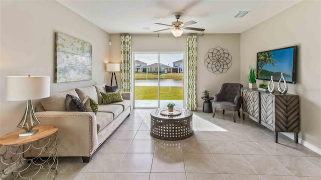 tiled living room featuring ceiling fan