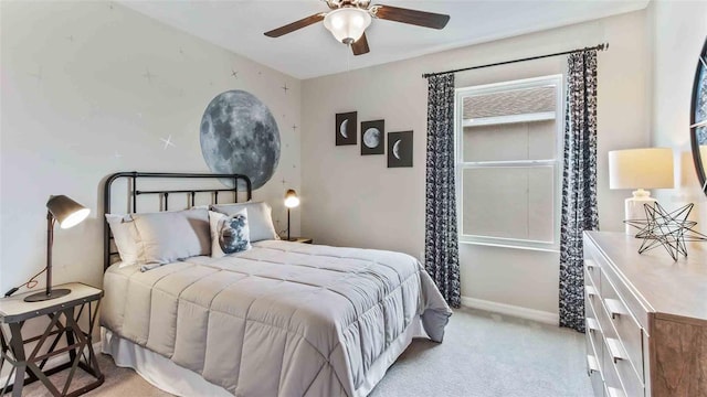 bedroom featuring ceiling fan and light colored carpet