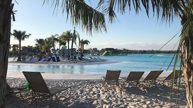 view of swimming pool with a water view