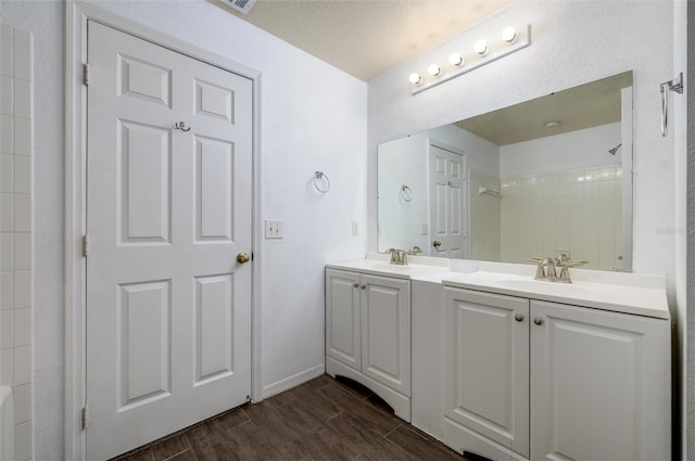 bathroom featuring vanity and walk in shower